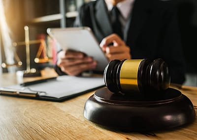 Judge with notepad and gavel