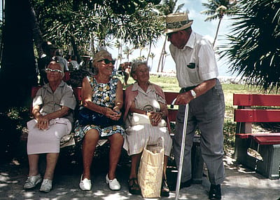 Retired friends sit on park benches in the South Beach area of Miami Beach in 1975