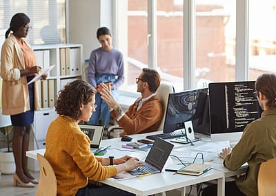 Software developers working in office.