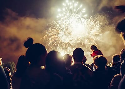 Crowd watching fireworks display on July 4th.