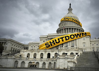 The Capital Building with police tape around it reading 'shutdown'