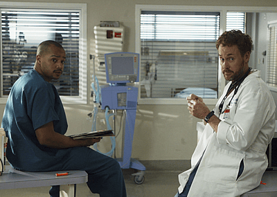 Actors Donald Faison and John C. McGinley work on the set of "Scrubs" at the old North Hollywood Medical Centerl on January 17, 2006 in North Hollywood, California.