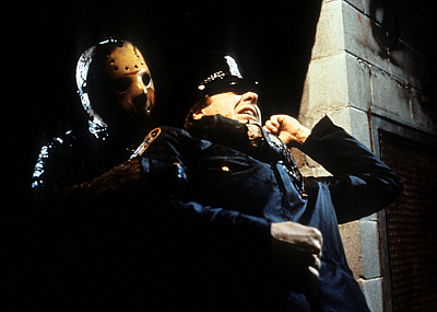 Jason grabs cop in a scene from the film 'Friday The 13th Part VIII: Jason Takes Manhattan', 1989.