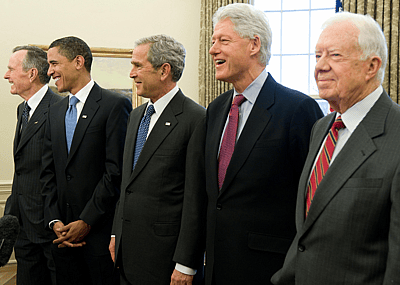 Former US Presidents George W. Bush (C), Barack Obama (2nd L), George H.W. Bush (L), Bill Clinton (2nd R) and Jimmy Carter (R) in the Oval Office of the White House in Washington, DC, on January 7, 2009.