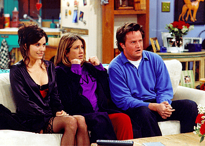 Actors Courteney Cox Arquette (L), Jennifer Aniston (C) and Matthew Perry are shown in a scene from the NBC series "Friends".