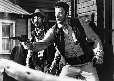 Actors James Arness and Ken Curtis in street scene of 'Gunsmoke.'