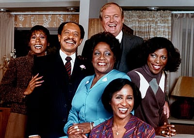 The cast of the TV sitcom 'The Jeffersons'—Berlinda Tolbert, Sherman Hemsley, Isabel Sanford, Franklin Cover, Roxie Roker, and Marla Gibbs—circa 1977 in Los Angeles, California.
