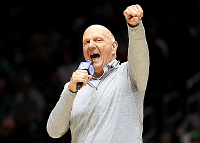 Steve Ballmer, owner of the LA Clippers, pumps up the crowd before a preseason NBA game between the LA Clippers and the Utah Jazz in 2023 in Seattle, Washington.