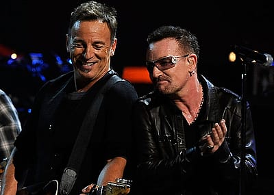 Bruce Springsteen and Bono perform at Madison Square Garden on Dec. 12, 2012 in New York City.