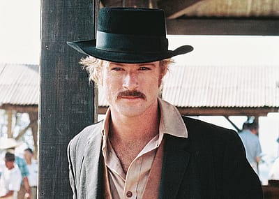 Actor Robert Redford in a black cowboy hat and tan leather waistcoat, in a publicity portrait issued for the 1969 Western film 'Butch Cassidy and the Sundance Kid.'