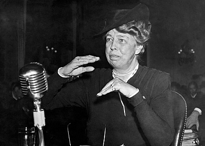 Eleanor Roosevelt in front of a microphone at a hearing in Washington DC, 1942.