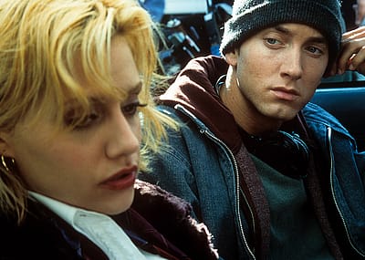 Eminem looks over at Brittany Murphy in a scene from the film "8 Mile."