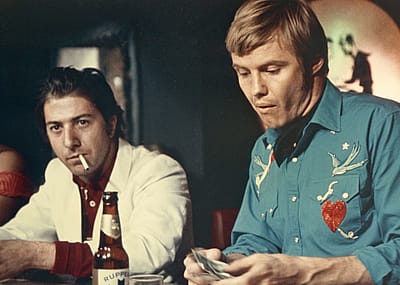 Jon Voight and Dustin Hoffman bat bar in scene from the 1969 film 'Midnight Cowboy'.