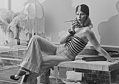 A model wearing wide-legged trousers, a striped tube top and a turban-style hat at the Biba boutique in London, UK, 6th September 1973.