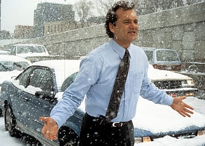 Bill Murray runs through the snow in a scene from the film 'Groundhog Day', 1993.
