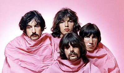Pink Floyd pose for a portrait in Los Angeles in August 1968. (L–R) Nick Mason, Dave Gilmour, Rick Wright (center front), and Roger Waters.