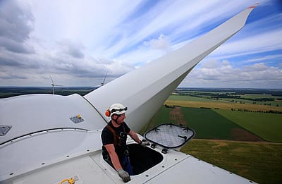 Service technician Andre Sebesta sits on the new Vestas V112 wind turbine at the wind farm in Barkhagen, Germany
