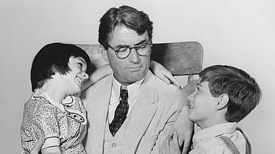 American actors Mary Badham (as Scout), Gregory Peck (as Atticus Finch), and Phillip Alford (as Jem) in a scene from 'To Kill a Mockingbird', 1962.