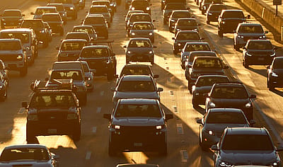 Traffic backs up on northbound Interstate 405 during the morning commute at sunrise in Los Angeles.