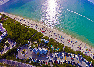 An aerial view of a crowded beach in Bonita Springs, FL.