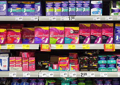 A store shelf displaying feminine products that are subject to the pink tax