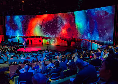 A TED talk inside the David Rockwell designed theater at TED 2018.