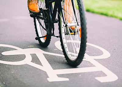 A person riding their bike to commute to work.