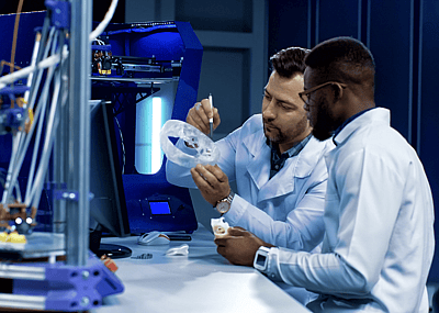 Two scientists use 3D printer
