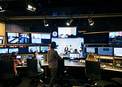 People working in a TV studio.