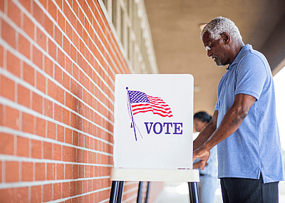 A person voting in an election