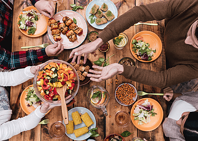 A spread of food on a rustic wooden table.