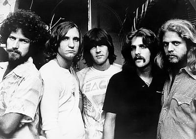 Don Henley, Joe Walsh, Randy Meisner, Glenn Frey, and Don Felder of the rock band the Eagles pose for a portrait in 1977.