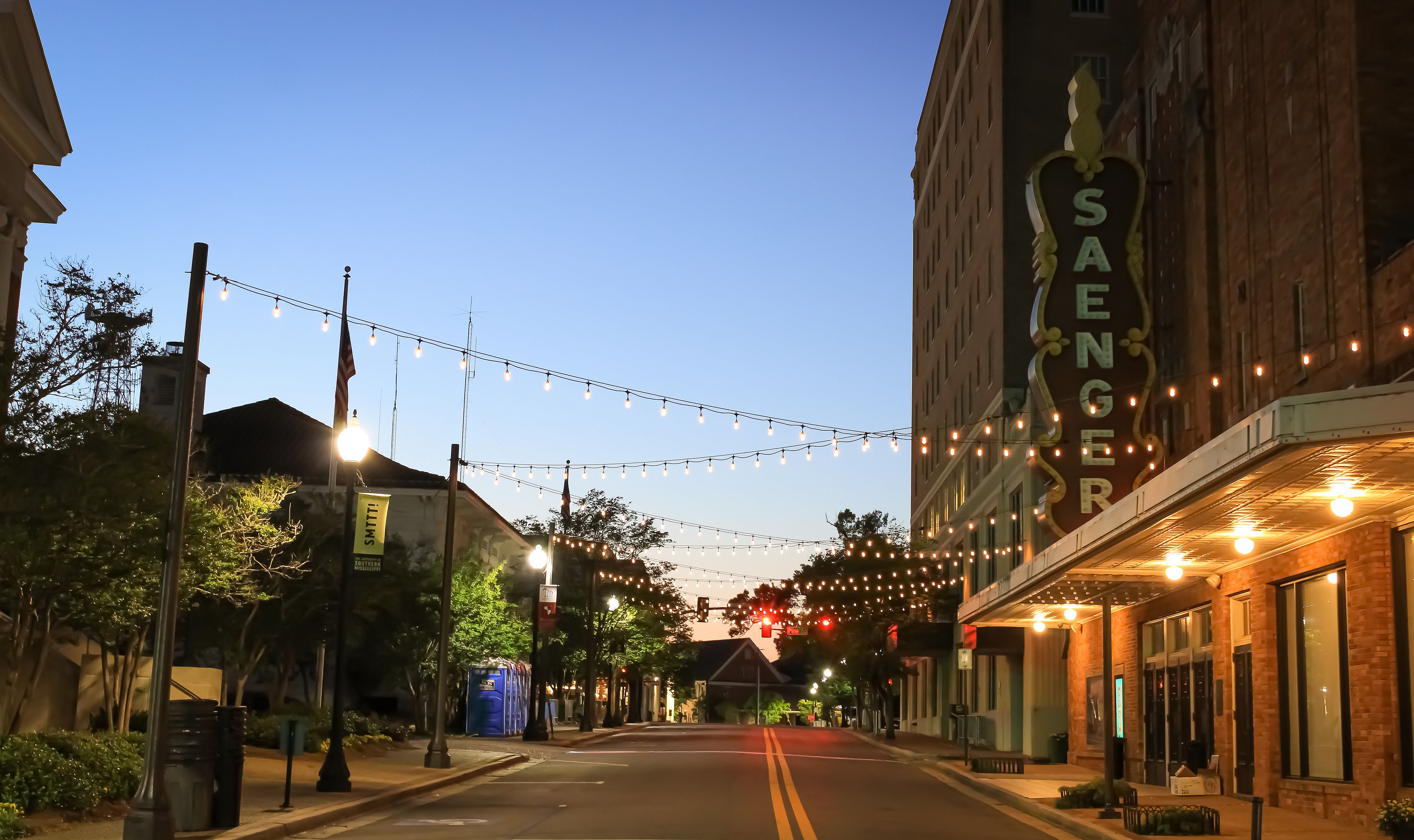 A historic theater with lights in the evening in Hattiesburg, Mississippi.