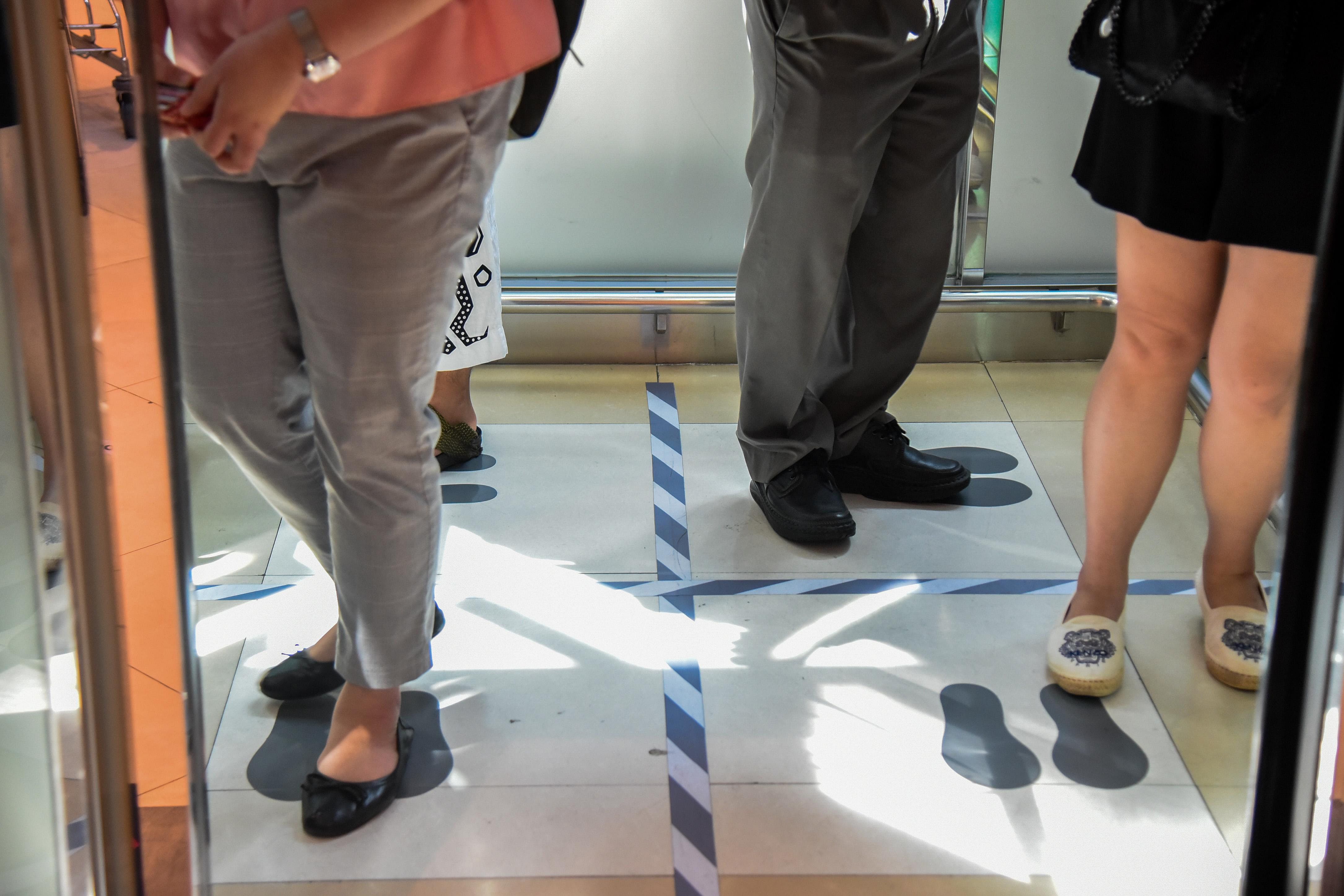 Following instructions on an elevator in Bangkok