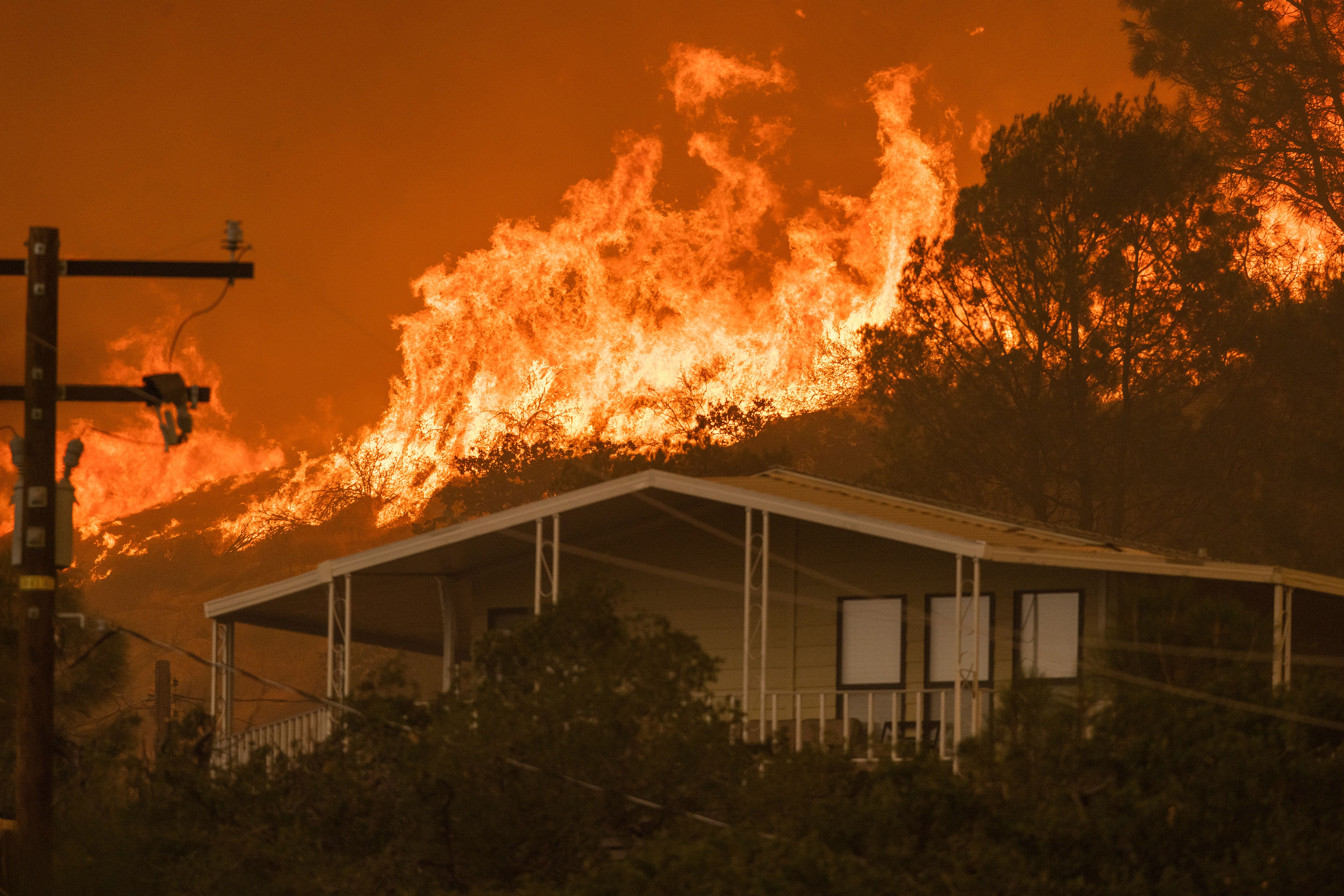 The French Fire comes close to destroying homes on August 24, 2021 in Wofford Heights, California.