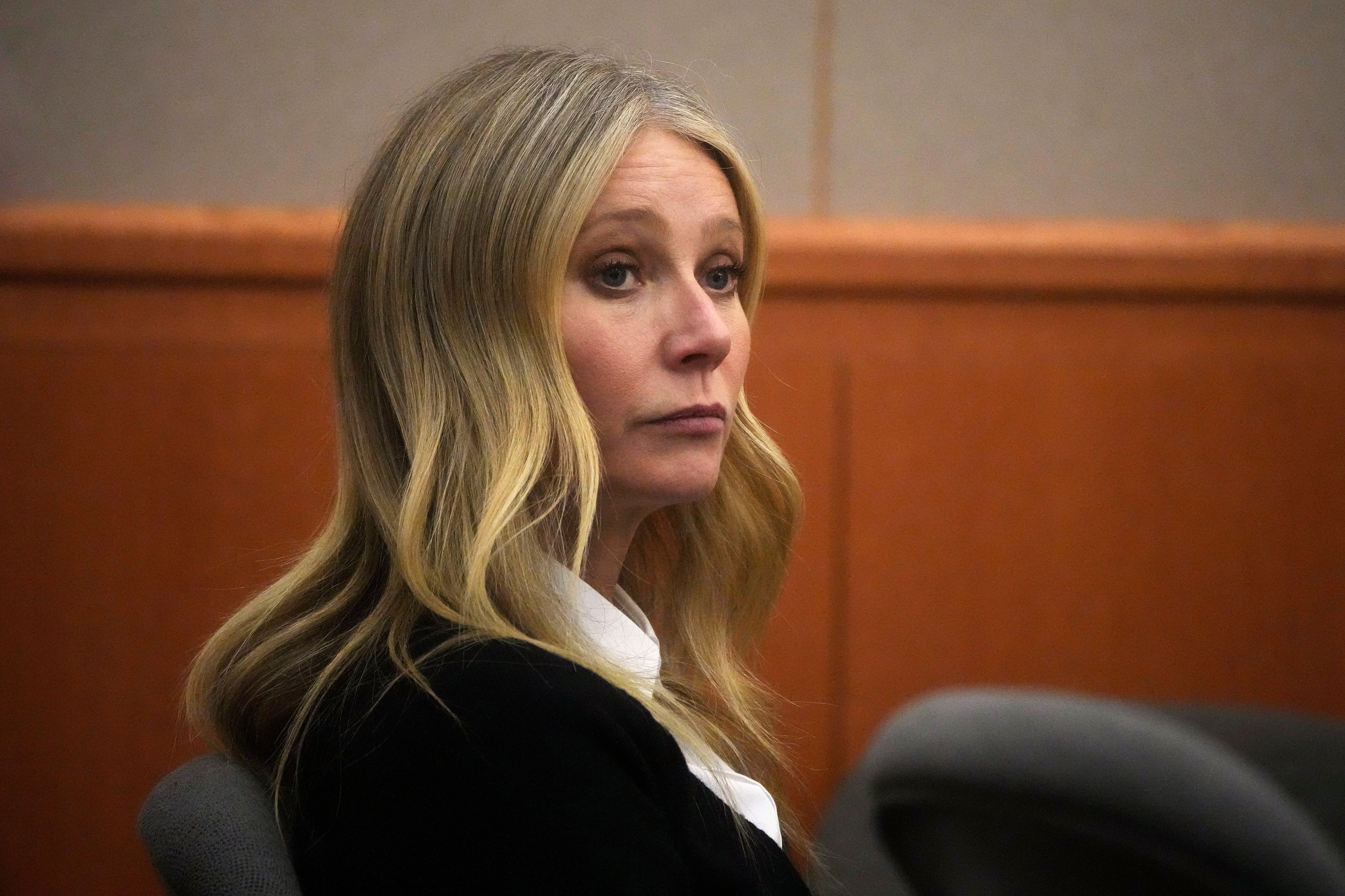Gwyneth Paltrow in a black suit.
