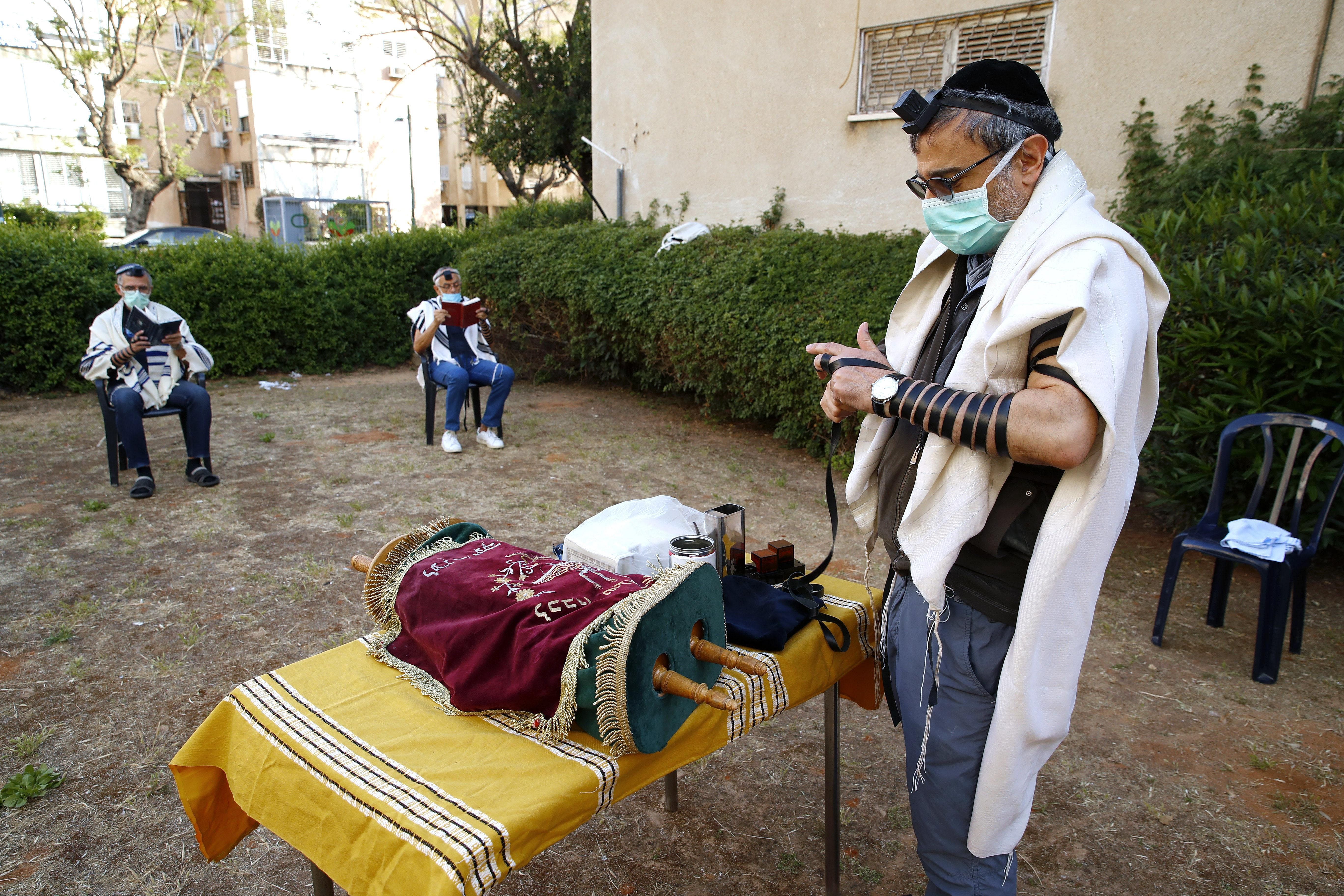 Distant prayer outside a closed synagogue in Israel