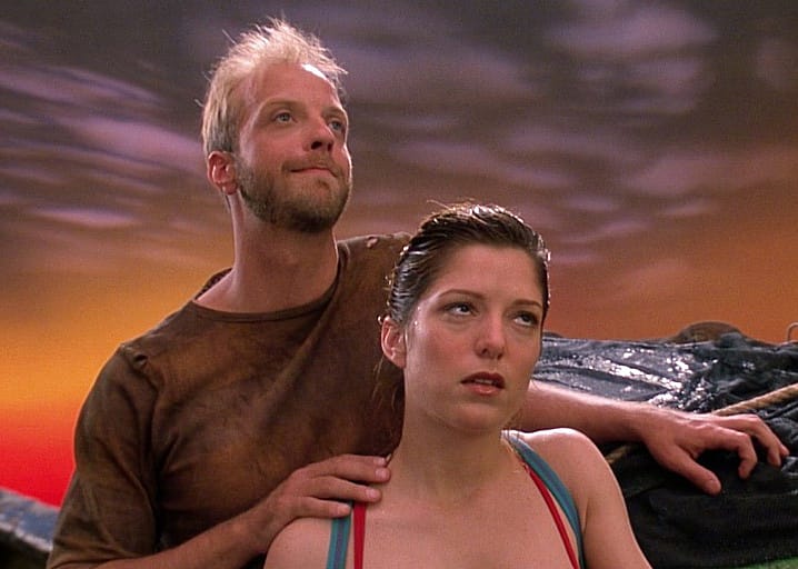 Melora Walters rolling her eyes with Chris Elliott behind her.