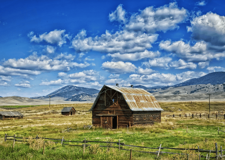 Old wooden barn with a rusty roof