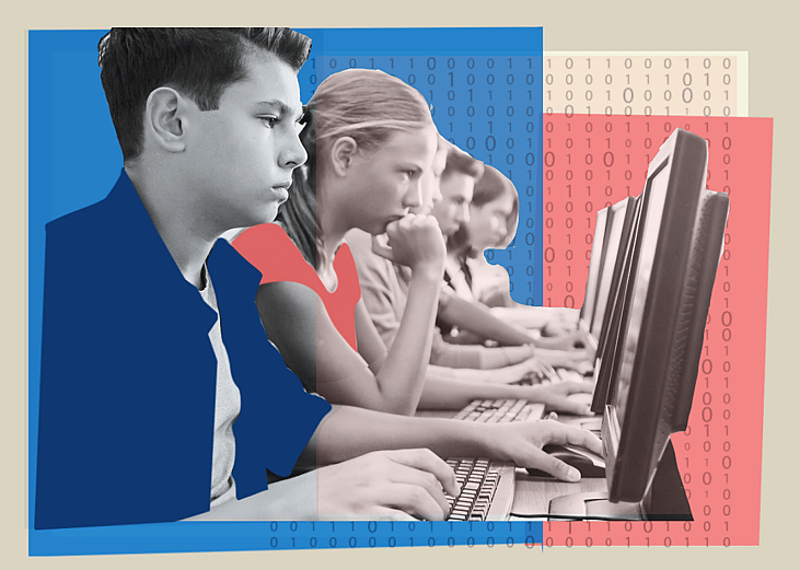 Students working at computers in a classroom.