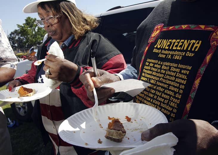 People take part in a cook-off contest at Juneteenth.