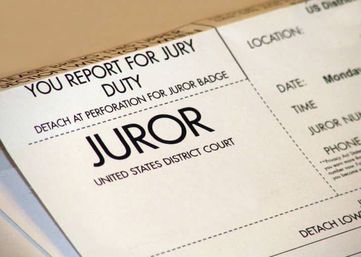 Jury duty summons and badge