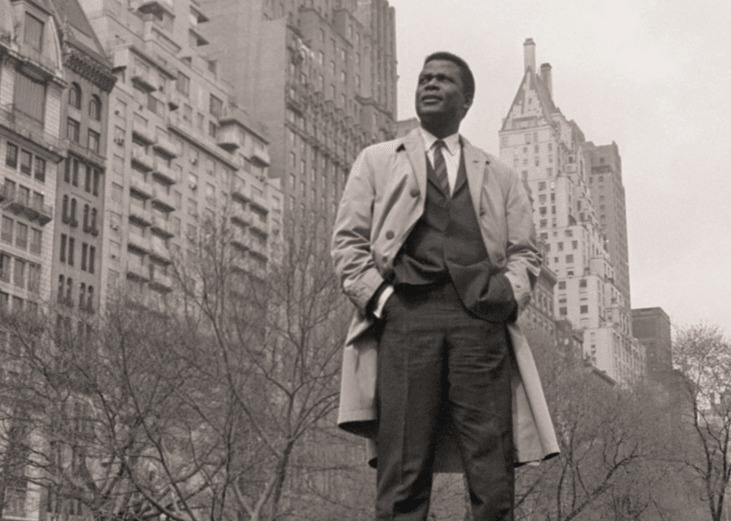 Sidney Poitier against a backdrop of New York apartment buildings.
