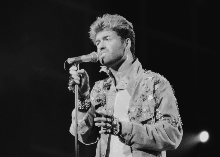 George Michael performing on stage.