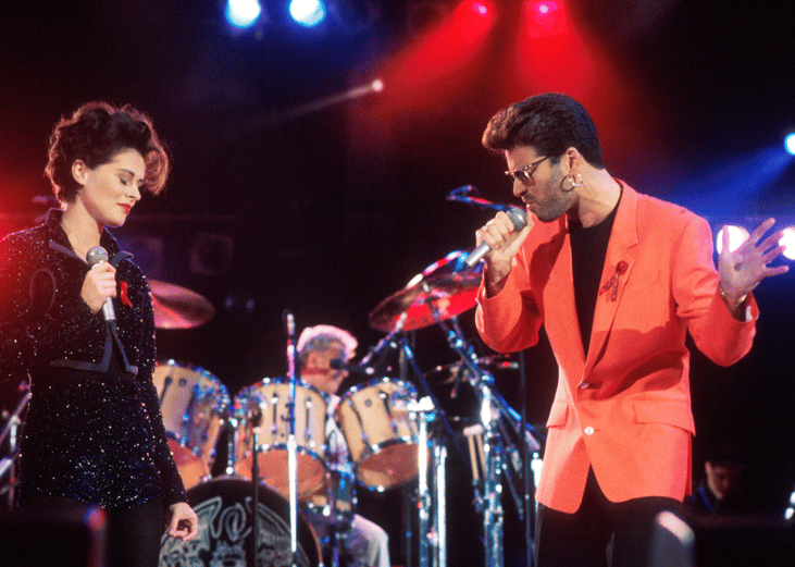 Lisa Stansfield, George Michael, and Roger Taylor perform at the Freddie Mercury Tribute Concert.