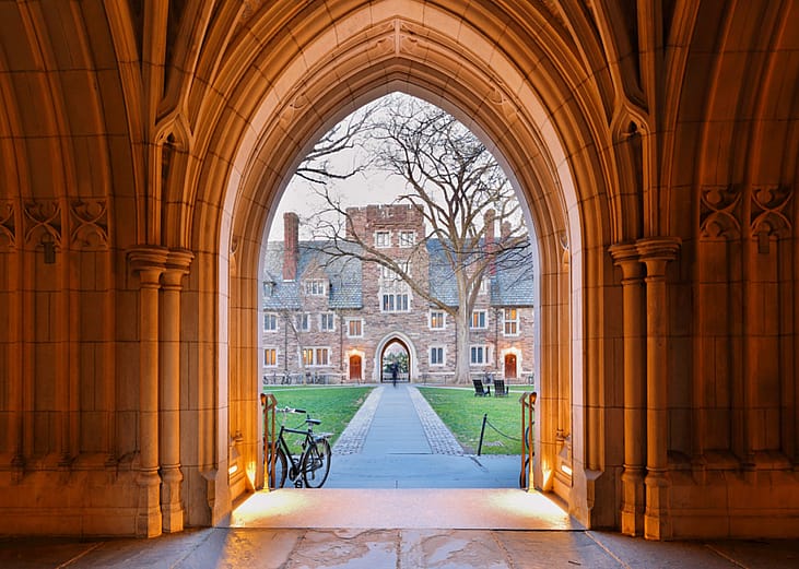 The arched hallway of Holden Hall at Princeton University