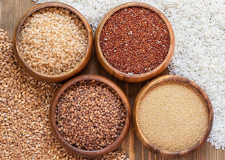 A selection of different grains in wood bowls.
