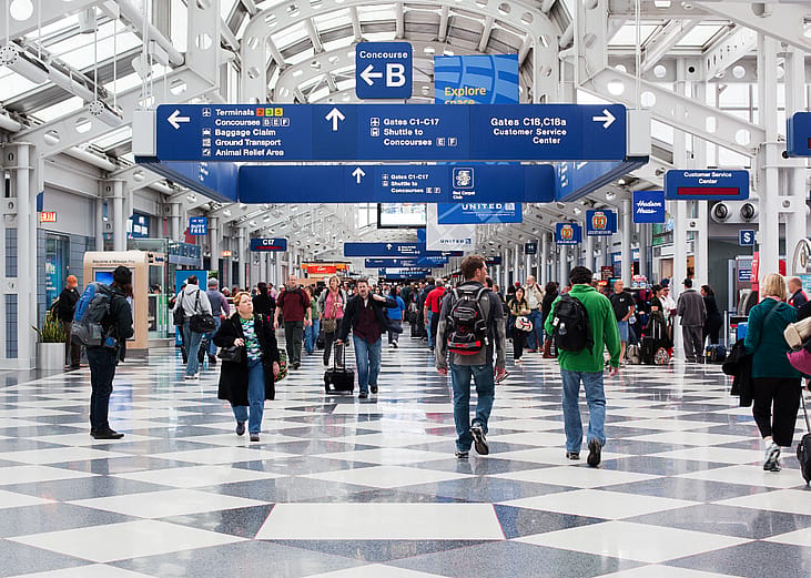 Travelers make their way through a terminal at Chicago's O'Hare airport.