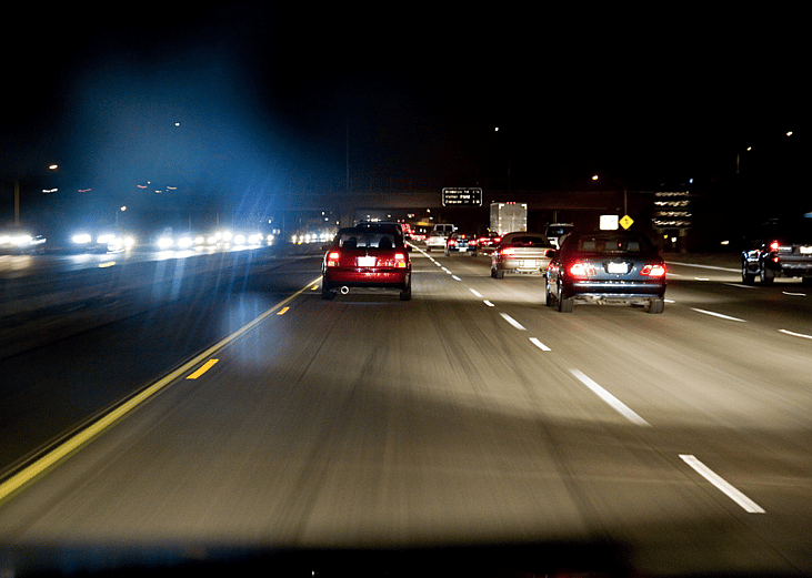 A freeway at night in traffic