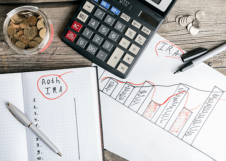 On a desk, a calculator, a handwritten financial plan, and a jar of coins